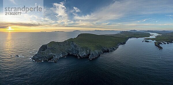 An aerial panorama view of the Bray Head cliffs and headland on Valentia Island at sunset