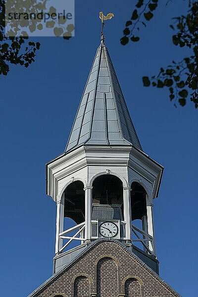 Historic wooden steeple of the church in the center of the village Midsland on the island of Terschelling in the northern Netherlands