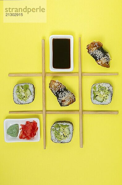 Food  Food  Creative Arrangement of Sushi and Sashimi on Yellow Background for Japanese Cuisine Concept