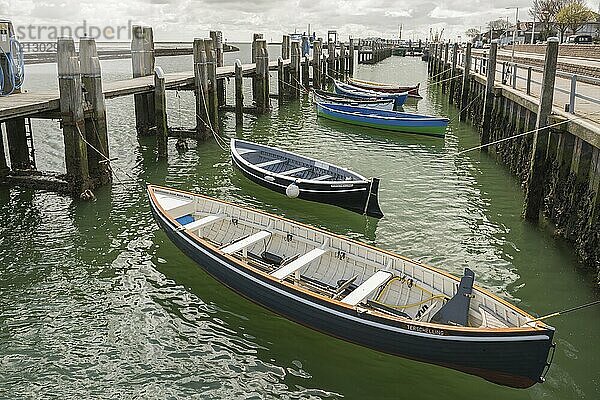 Rowing boats in the harbour of West Terschelling on the island of Terschelling in the North of the Netherlands