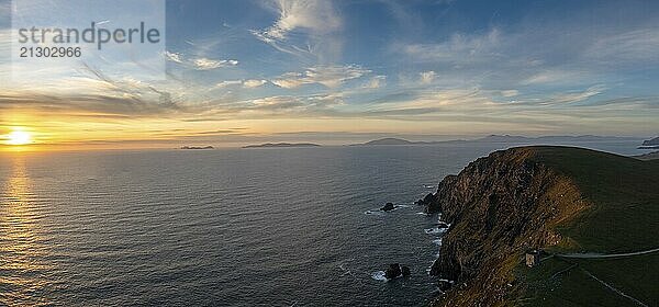 An aerial panorama view of the Bray Head cliffs and headland on Valentia Island at sunset