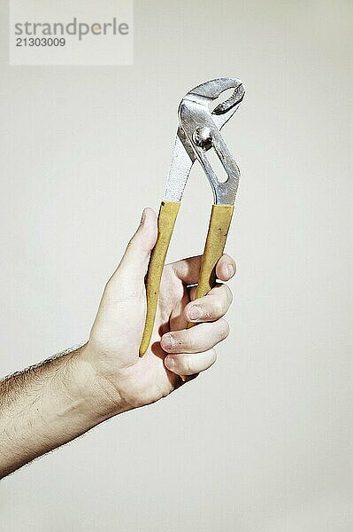 Hand with Tweezers on white background