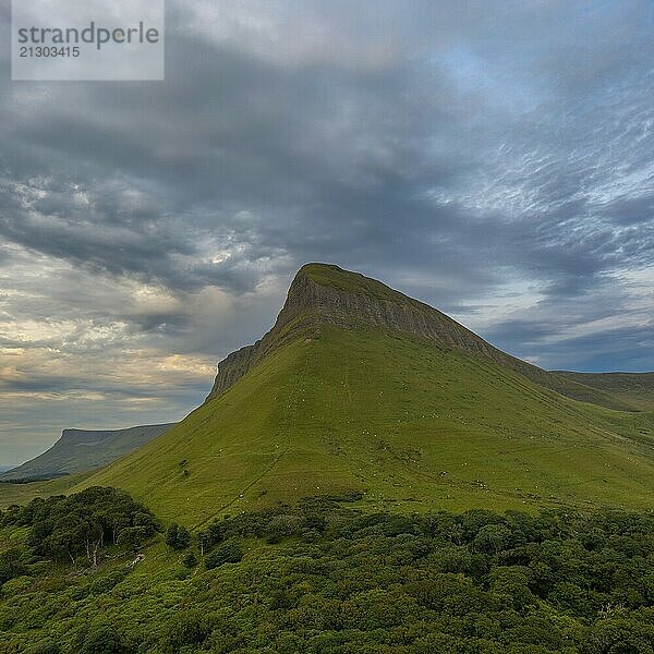 View of the sunset and overcast sky in the evening around Bunbeg table top mountain in County Sligo in western Ireland