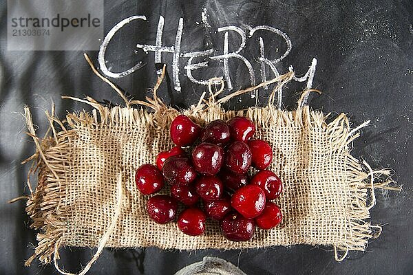 Presentation of a group of cherries on a black background