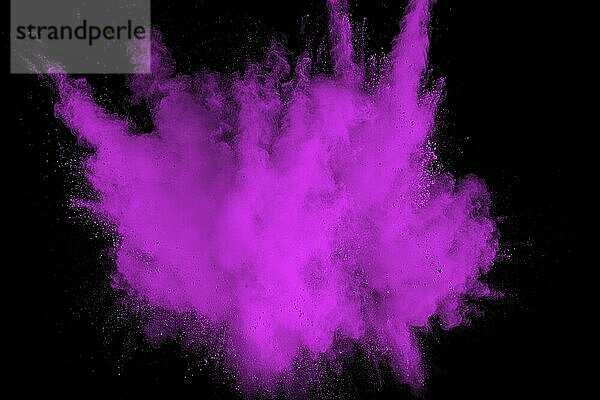 Pink powder explosion on black background. Pink dust splash cloud on dark background