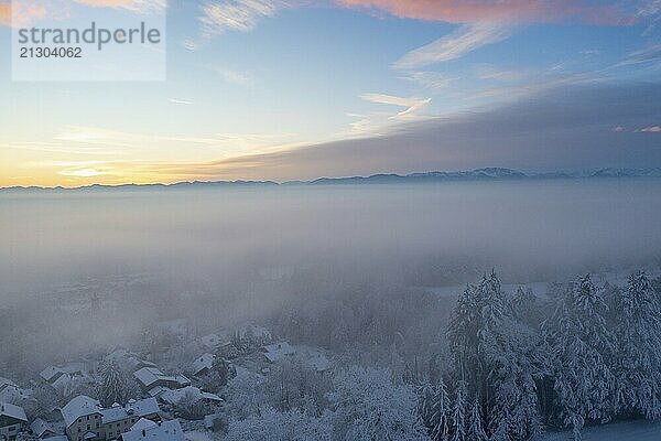 Loisach valley with Eurasburg  Schlossberg  winter at sunrise  drone shot  Upper Bavaria  Bavaria  Germany  Europe