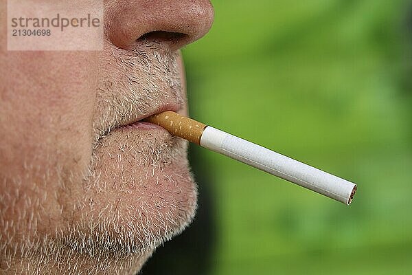 Man with a cigarette in his mouth