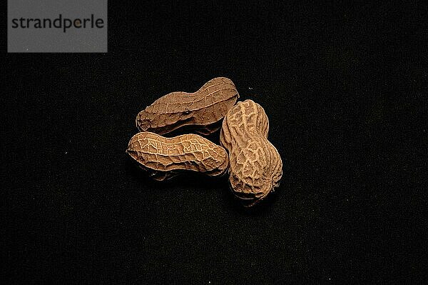 Close View of Peanuts against black background