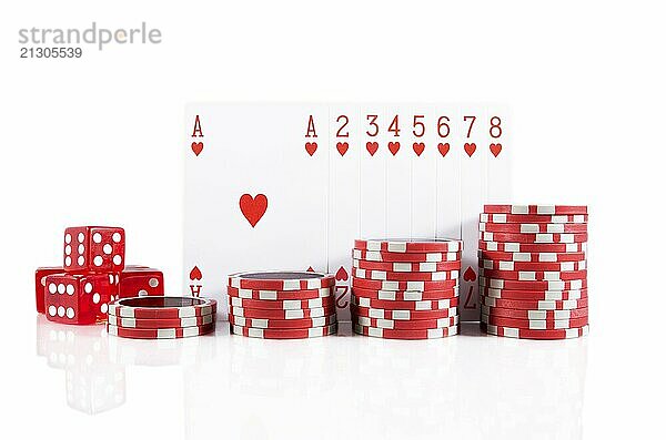 Group of poker cards  poker chips  and red dice over white isolated background