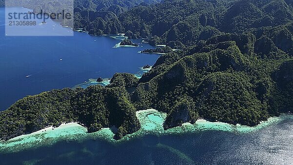 Aerial view of tropical Coron island in Philippines. Blue lagoons and lakes  white sand beach  rocks cliffs mountains and beautiful coral reef