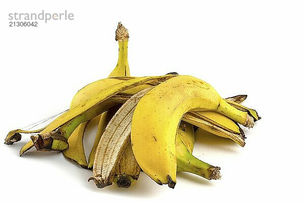 Bunch of banana skin isolated on white background. Organic residues of fruit waste