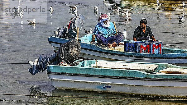 Fishermen working on their boats in the harbour of Mirbat  Dhofar Province  Arabian Peninsula  Sultanate of Oman