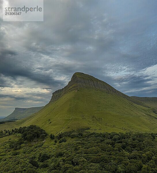 View of the sunset and overcast sky in the evening around Bunbeg table top mountain in County Sligo in western Ireland