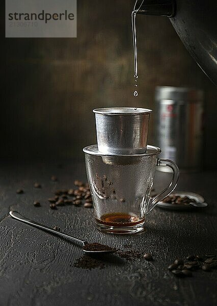 Food  Food  Preparation of Vietnamese coffe with aluminum cofe filer on dark background