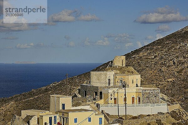 Traditional building on the coast with picturesque views of the sea and mountains  Colourful mountain village  Morning light  Olymbos  Karpathos  Dodecanese  Greek Islands  Greece  Europe