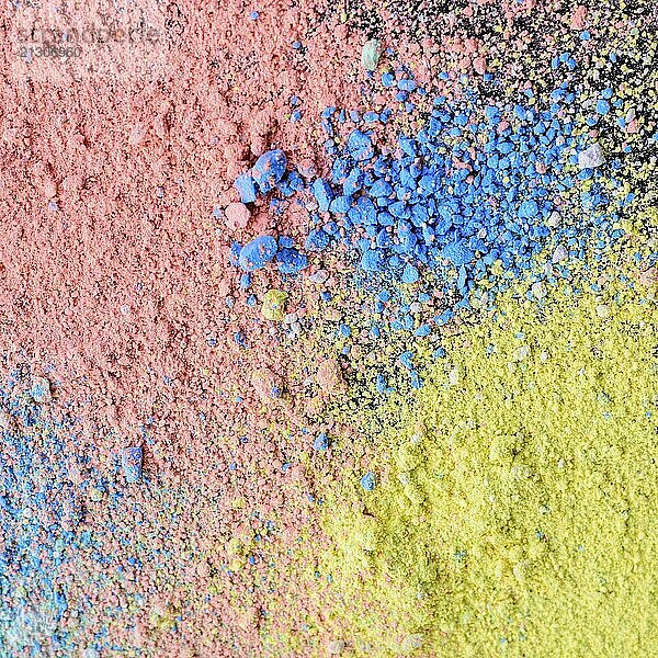 Colorful background of chalk powder. Multicolored dust particles splattered on black background