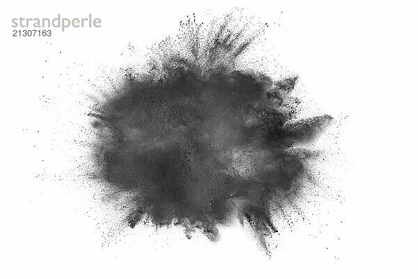 Black powder explosion against white background.Black dust particles splash