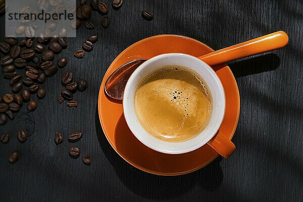 Presentation of a cup of coffee on a black background