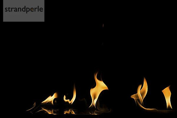 Fire flame on black background. Blaze fire flame textured background