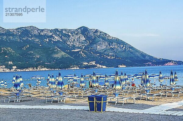 View on beach sea and mountain at the summer evening in Becici  Montenegro  Europe