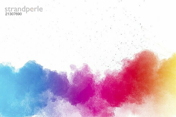 Multi colour powder explosion on white background. Launched colourful dust particles splashing