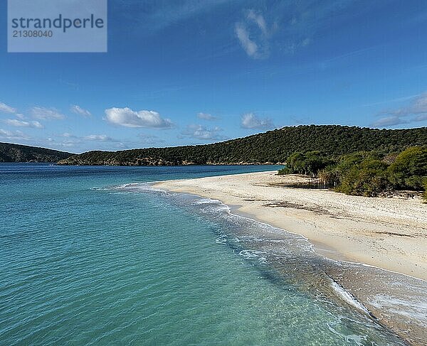 A view of the beautiful wihtie sand beach and turquoise waters at Turredda Beach in Sardinia