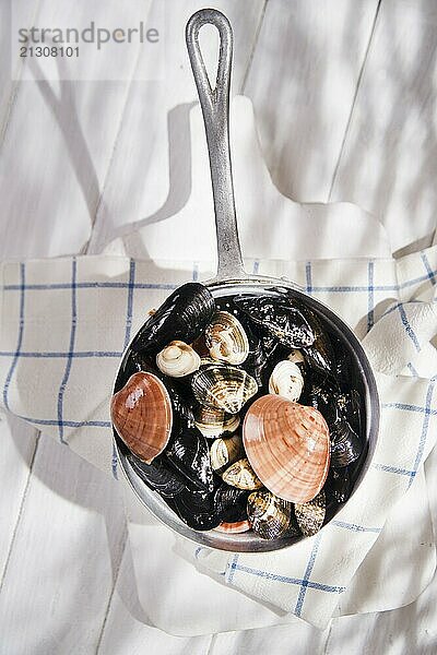 Necessary ingredients for a soup with seafood on a white background