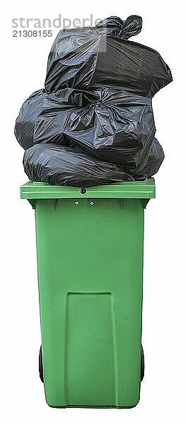 A Green Wheelie Bin  Overflowing With Bin Bags (Trash)  Isolated On A White Background