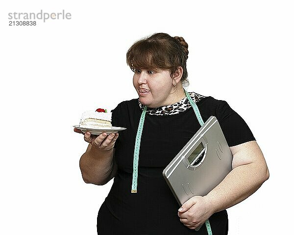 Dieting overweight women with cake isolated on white