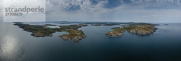 A wide panorama landscape of the islands and coastline of Baltimore Harbor in West Cork County in Ireland