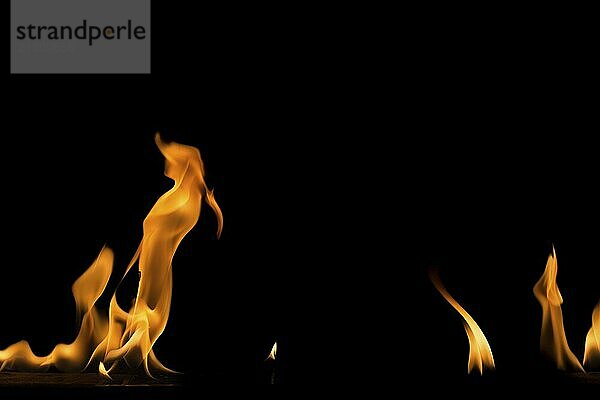 Fire flame on black background. Blaze fire flame textured background