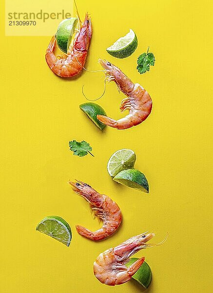 Food  Food  Flying food. Seafood shrimps prawns with cilantro amd lemon yellow background