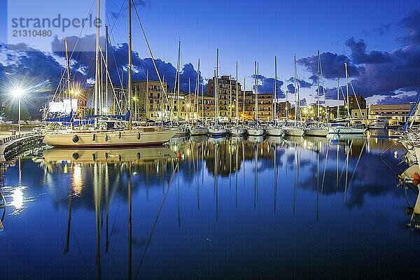 Idyllic view on Sailboats in harbor of Palermo -blue time in the city. Wonderful cloudscape