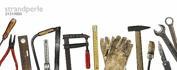 Old craftsman's tools against a white background