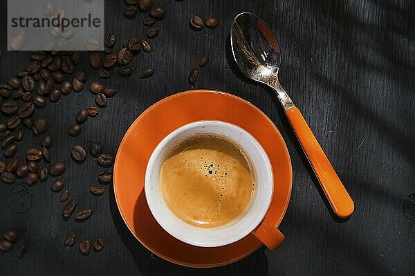 Presentation of a cup of coffee on a black background