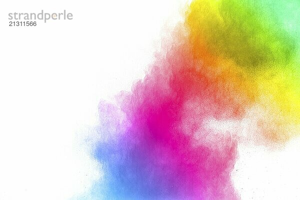 Abstract color powder explosion on white background.Freeze motion of dust splash. Painted Holi in festival