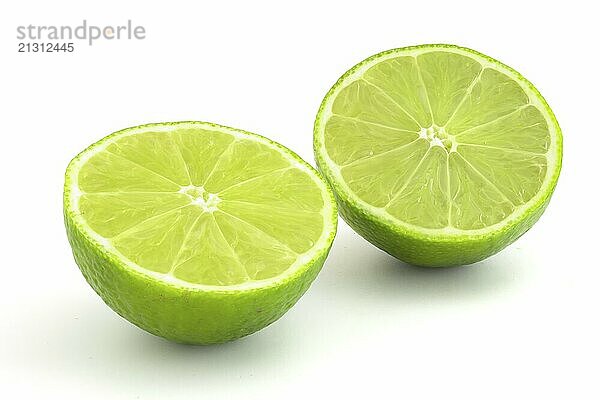 Lime in section isolated on white background. Ripe green citrus for cocktails and alcoholic beverages