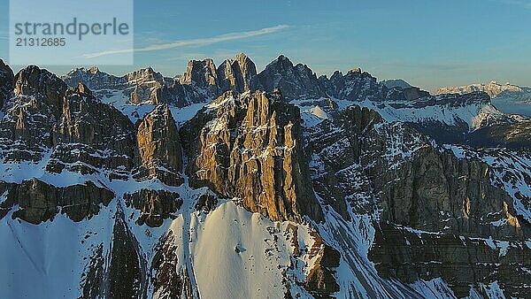 Aerial view of amazing rocky mountains in snow at sunrise  Dolomites  Italy  Europe