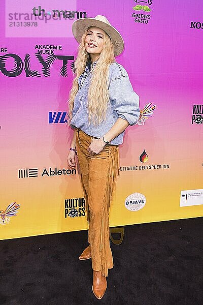 Anne West (Anne Heinz) on the red carpet in front of the Polyton 2024 award ceremony in Berlin's Atelier Gardens on 23 October 2024. The award has been held since 2023 and is a successor to the Echo music award