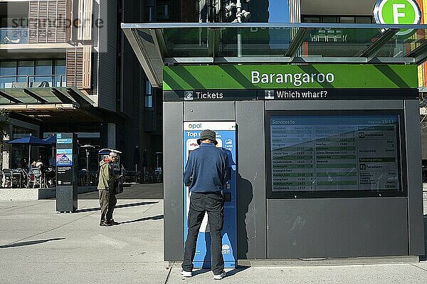 16/09/2018  Sydney  New South Wales  Australia  A man buys a ferry ticket on the boardwalk at Wulugul Walk in Barangaroo South  Oceania