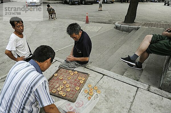 01.08.2012  Chongqing  China  Asia  Men playing Chinese chess  also called Xiangqi  Asia