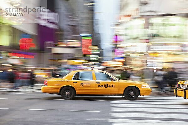 Panning image of a Yellow Taxi cab in Times Square  New York City. New York. USA