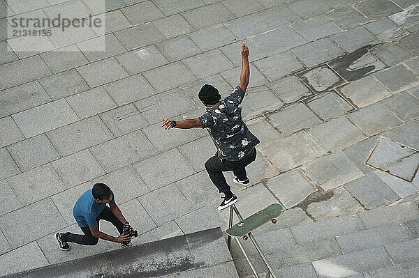 01/06/2018  Singapore  Republic of Singapore  Asia  A skater jumps with his skateboard from a banister in Marina Bay  Asia