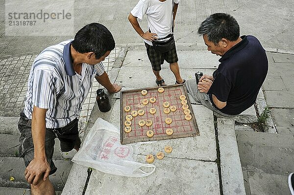 01.08.2012  Chongqing  China  Asia  Men playing Chinese chess  also called Xiangqi  Asia