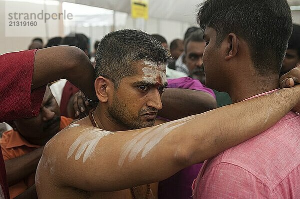 31.01.2018  Singapore  Republic of Singapore  The skin of a devout Hindu man is pierced with metal hooks in the back as he prepares for the Thaipusam festival procession at the Sri Srinivasa Perumal Temple in Little India  leading to the Sri Thendayuthapani Temple on Tank Road  4 kilometres away  Asia