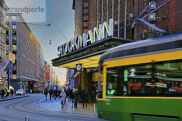 Stockmann Helsinki Centre  culturally significant department store in Helsinki  Finland  with shoppers and tram  defocused. December 3  2019  Europe