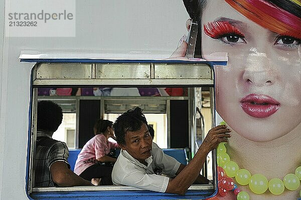 10.04.2014  Yangon  Republic of the Union of Myanmar  Asia  A man looks out of the window of a waiting Circle Line commuter train at the main railway station