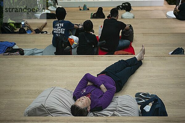 18.04.2019  Singapore  Republic of Singapore  Asia  A man takes a nap in Terminal 3 at Changi International Airport  Asia