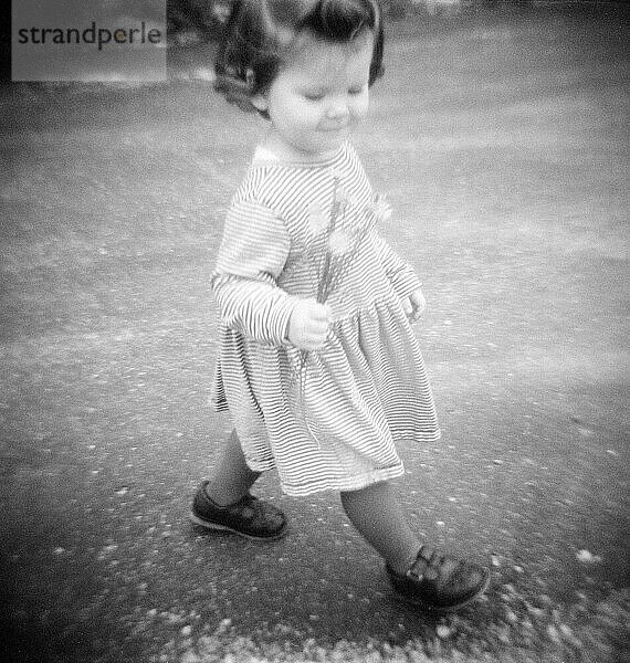 Little Girl and Flowers