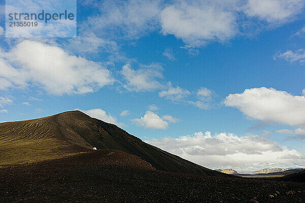 Wedding couple against mountains in Iceland